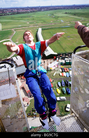 Young man releases into a bungee jump Stock Photo