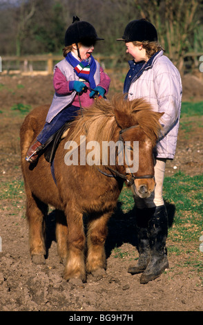 Child riding a Shetland pony