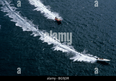 Two multi-pilot  Powerboats race each other off sea coast Stock Photo