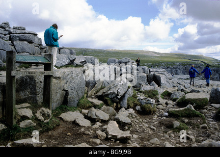 Walkers standing on top of Pennine Way Stock Photo