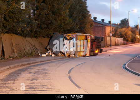 Overturned crashed HGV lorry with chemical drums on board Stock Photo