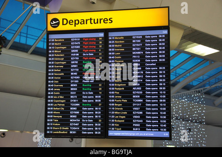 Electronic departure board in Departure Lounge, South Terminal, Gatwick Airport, Crawley, West Sussex, England, United Kingdom Stock Photo
