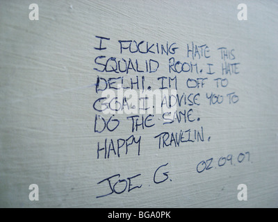 Wall writing at a cheap backpacker hotel in Paharganj area in Delhi, India Stock Photo