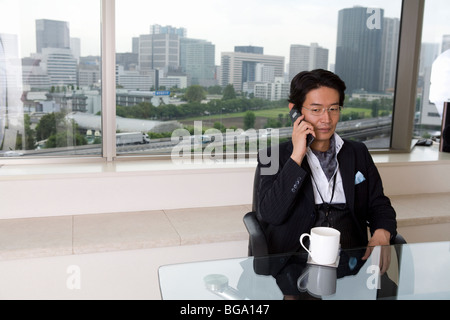 Mature man talking on cellular phone Stock Photo