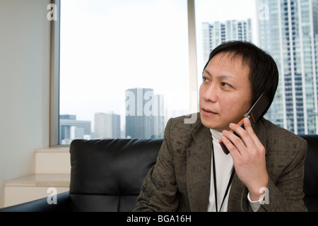 Mature man talking on cellular phone Stock Photo