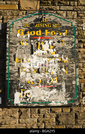 Tatty GOOD FOOD board outside The Old Rising Sun pub closed and derelict in Newport South Wales UK Stock Photo