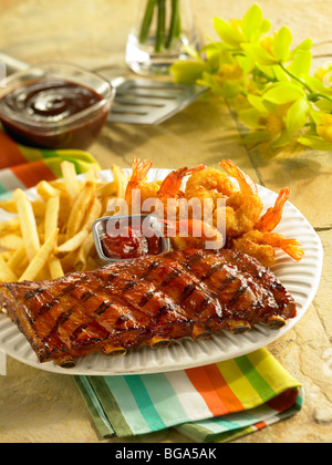 BBQ pork short ribs with fried shrimp and fried potatoes Stock Photo
