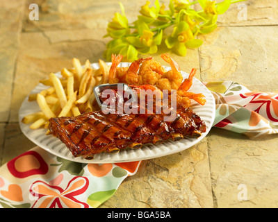 BBQ pork short ribs with fried shrimp and fried potatoes Stock Photo