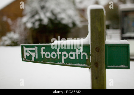 Footpath sign in snow Stock Photo