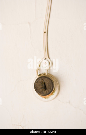 Old fashioned light switch on a wall, Venezuela Stock Photo