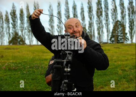 Landscape photographer Tony Wainwright with a 6x17 panoramic camera on tripod working in East Sussex fields. Stock Photo