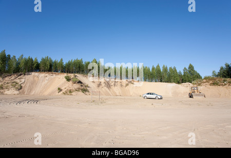 Gravel pit bottom where fine sand is extracted from an ice-age esker ridge , Finland Stock Photo