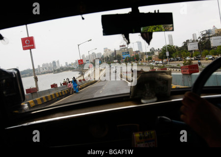 The view from inside a taxi driving along the Marine Drive in Mumbai (formerly Bombay) in India. Stock Photo
