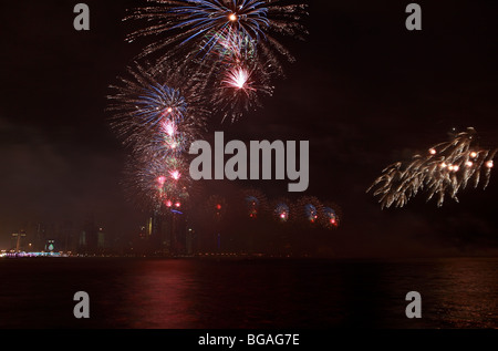 Fireworks going off over Doha Bay to mark Qatar National Day 2009 Stock Photo