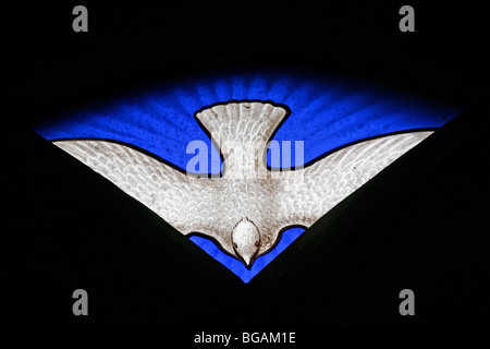 A stained glass window depicting the dove of the Holy Spirit, St Nicholas Church, Fisherton Delamere, Wiltshire Stock Photo