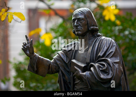 Statue to the founder of English Methodism John Wesley in St Paul's Cathedral churchyard in London UK Stock Photo