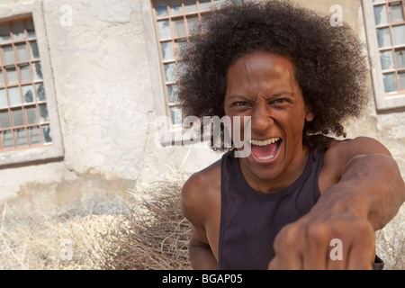 An african american male gestures for the camera Stock Photo
