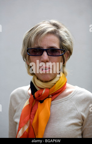 Smart Women in her late fifties/early sixties wearing scarf and sunglasses Stock Photo