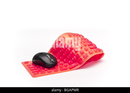 magenta flexible computer keyboard with black mouse isolated on white background Stock Photo