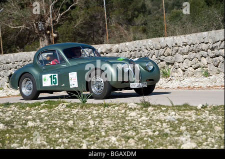 Green 1954 Jaguar XK 120 coupe car taking part in a rally in Spain Stock Photo