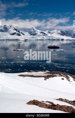 The expedition cruise ship Minerva anchored in Neko Harbour, Antarctica Stock Photo