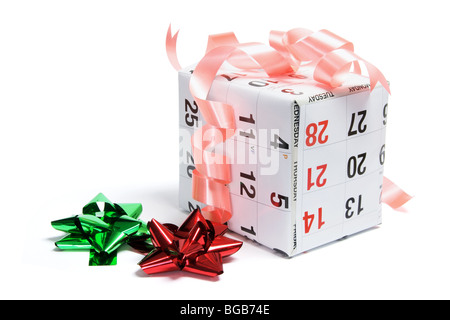 Gift Box Wrapped with Calendar Page Stock Photo