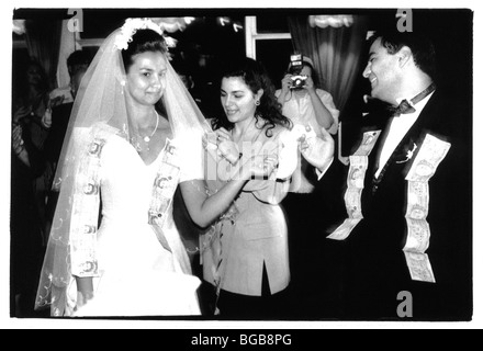 Religion Christian Weddings Traditional Greek Wedding Ceremony. Money Being Pinned To The Bride And Groom. Stock Photo