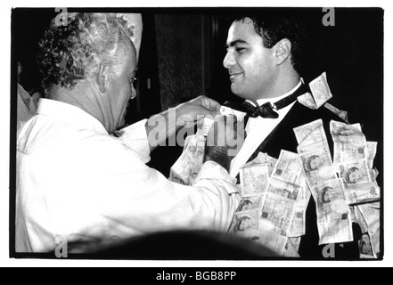 Religion Christian Weddings Traditional Greek Wedding Ceremony. Money Being Pinned To The Groom. Stock Photo