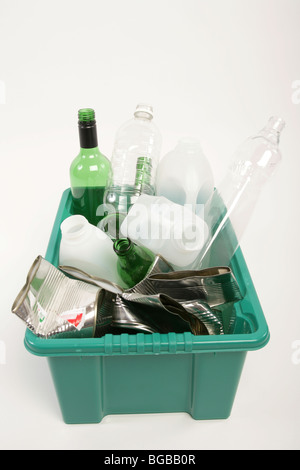 Plastic and glass bottles and tin cans in a plastic recycling box Stock Photo