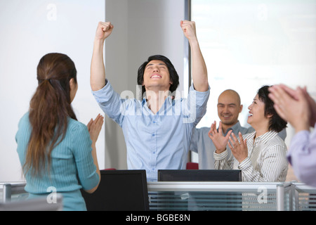 Office workers celebrate a success Stock Photo