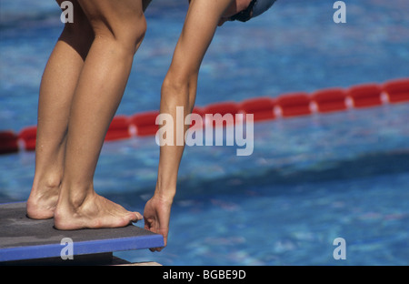 Swimmer set to dive into the pool Stock Photo