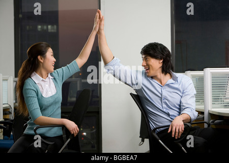 Office workers celebrate a success Stock Photo