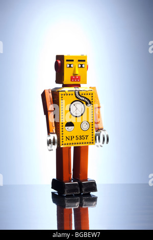 Tinplate robot on blue background Stock Photo