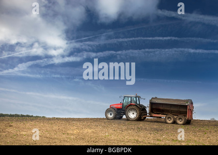 Tractor muck spreading Stock Photo