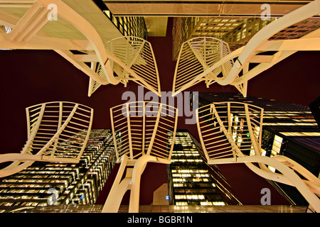 Looking up from the street to the steel 'Trees' sculpture and high-rise buildings along Stephen Avenue Mall (aka Stephen Avenue  Stock Photo