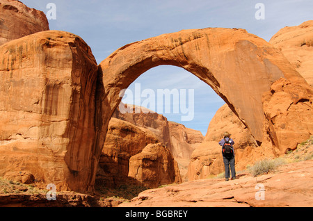 Hiker, Rainbow Bridge, Lake Powell, Glen Canyon, Arizona, United States Stock Photo