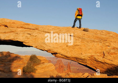 Hiker, Mesa Arch, Canyonlands National Park, Utah, USA Stock Photo