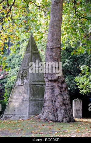 Pyramid shaped stone in the Graveyard of St Anne's Church Limehouse Stock Photo