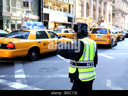 NYPD Officer At Work Directing Traffic Midtown Manhattan New York USA ...