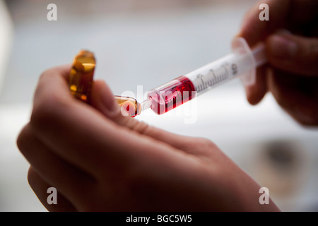 Mounting a syringe Stock Photo