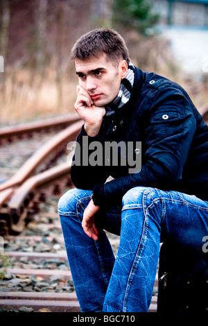 Man at rail track Stock Photo