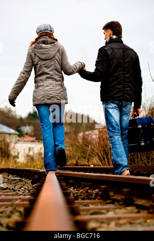 Couple on rail track Stock Photo