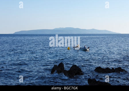 Fishermen in a boat, Cres Island, view from Ika, Istria, Kvarner Gulf, Croatia, Europe Stock Photo