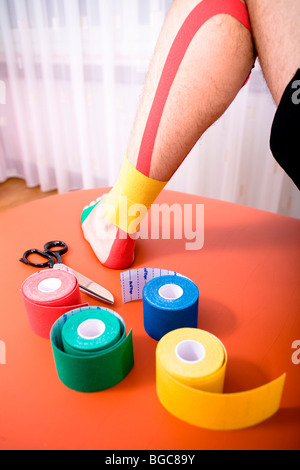 Patient getting a meditape treatment Stock Photo