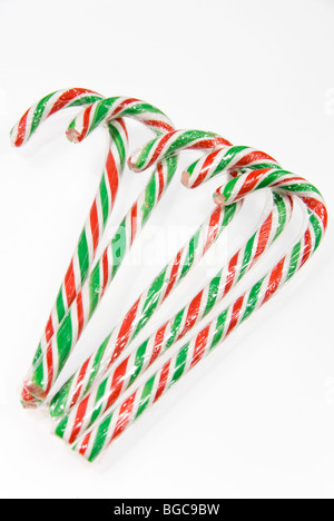 Five Red and Green Striped Christmas Candy Canes Isolated on a White Background Stock Photo