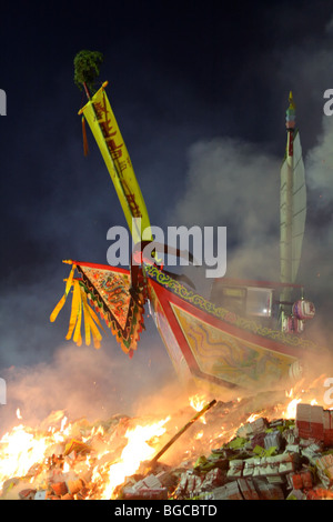 wood boat burning for a taiwanese festival Stock Photo