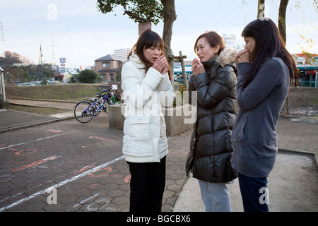 Three housewives standing in park Stock Photo