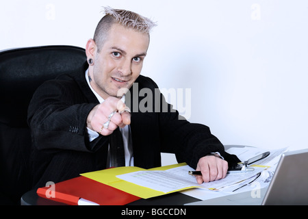 studio shot of isolated picture of a strange caucasian businessman with piercing and tattoo Stock Photo