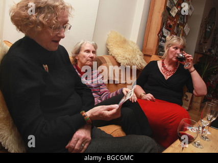 3 women talking and drinking wine together. Stock Photo