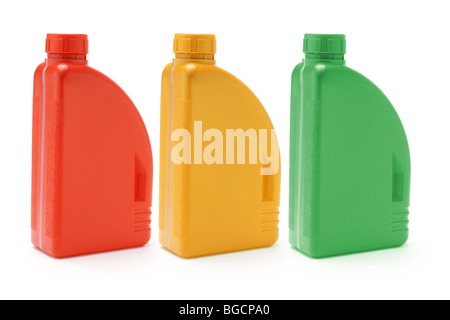Three color containers of motor oil on white background Stock Photo